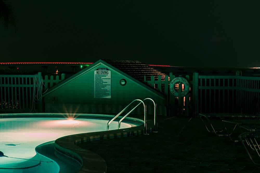 A night time shot of a public pool.