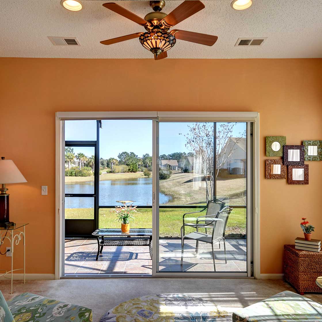 HDR image of a bright orange room with an outdoor patio.